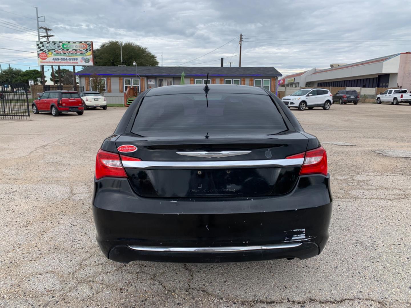 2012 Black /Black Chrysler 200 LX (1C3CCBAB3CN) with an 2.4L L4 DOHC 16V engine, Automatic transmission, located at 1830 North Belt Line Road, Irving, TX, 75061, (469) 524-0199, 32.834373, -96.993584 - Photo#4